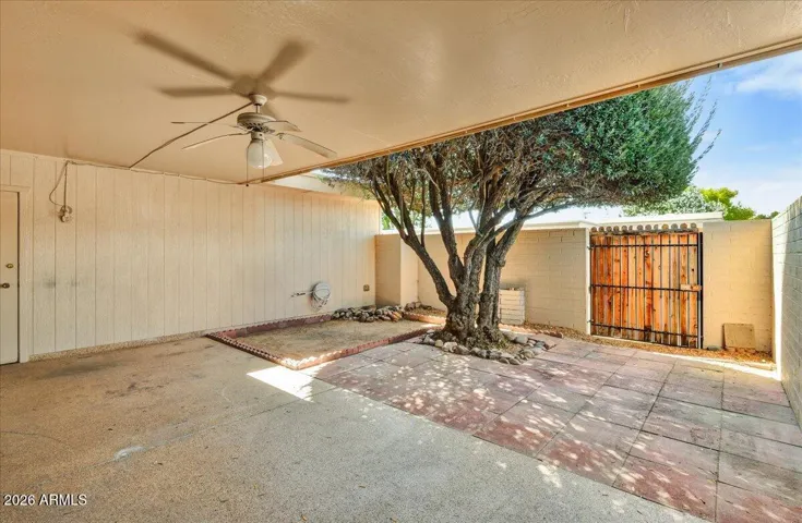 Expansive covered back patio, perfect for outdoor dining, relaxing in the shade, and enjoying the Arizona weather.
