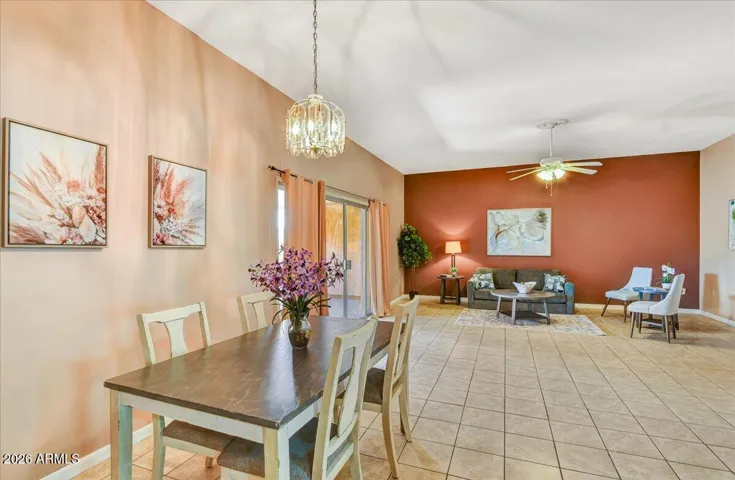 Inviting and open-concept great room boasting warm neutral tones, a stylish accent wall, and a comfortable layout perfect for entertaining.