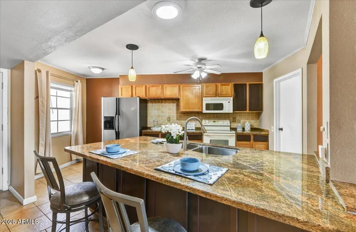 another view of this opened up kitchen and large island
