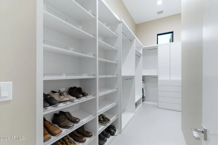 “The primary retreat features his-and-hers walk-in closets, both generously sized to accommodate a curated wardrobe.”