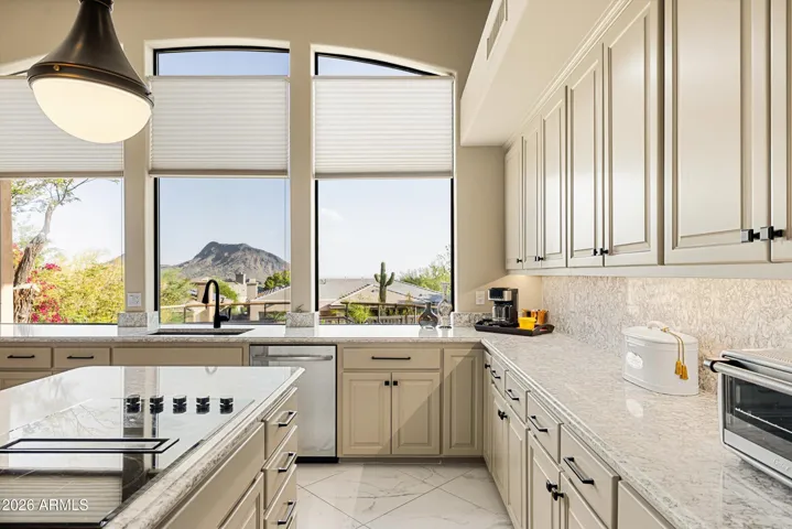 Even the kitchen window boasts a view of the mountains.