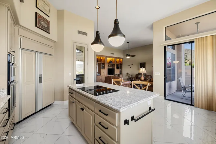 The kitchen island doubles as a breakfast bar.