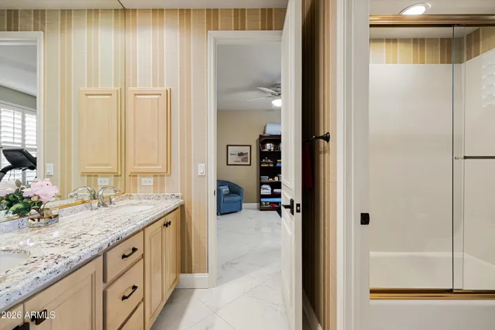 The Jack & Jill bathroom offers dual vanities and a tub/shower combo.