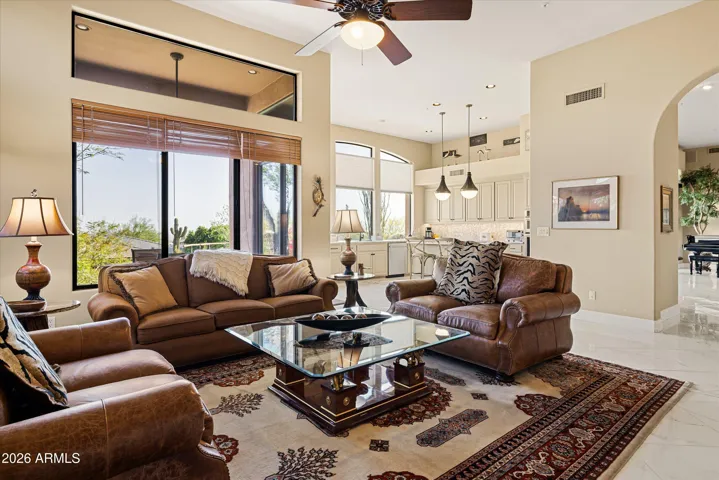 Family room flows into the kitchen with large windows allowing for an abundance of natural light.