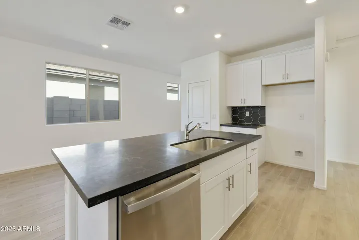 COMES WITH PAINTED CABINETS, QUARTZ COUNTERS, DESIGNER BACKSPLASH, GOURMET KITCHEN PHOTOS ARE OF ANOTHER HOME WITH SIMILAR SELECTIONS.