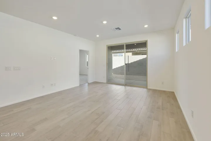 BEAUTIFUL WOOD PLANK TILE FLOORING THROUGH OUT EXCEPT FOR THE BEDROOMS