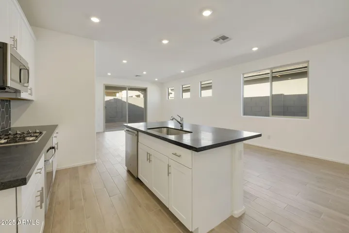 COMES WITH PAINTED CABINETS, QUARTZ COUNTERS, DESIGNER BACKSPLASH, GOURMET KITCHEN PHOTOS ARE OF ANOTHER HOME WITH SIMILAR SELECTIONS.