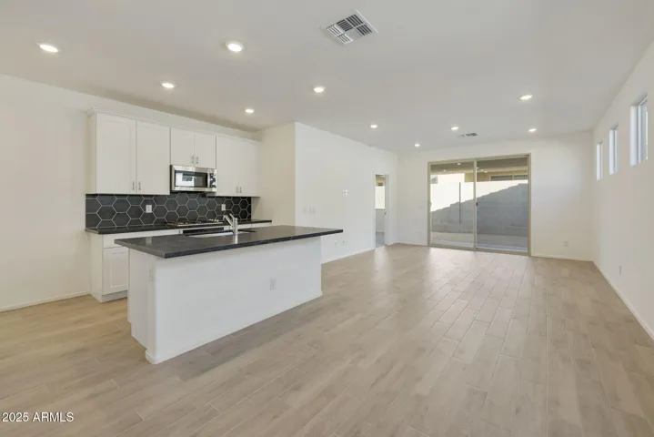 COMES WITH PAINTED CABINETS, QUARTZ COUNTERS, DESIGNER BACKSPLASH, GOURMET KITCHEN PHOTOS ARE OF ANOTHER HOME WITH SIMILAR SELECTIONS.