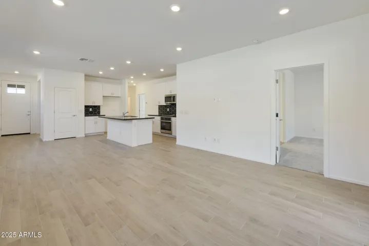 BEAUTIFUL WOOD PLANK TILE FLOORING THROUGH OUT EXCEPT FOR THE BEDROOMS