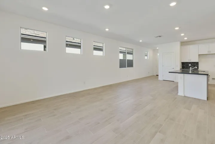 BEAUTIFUL WOOD PLANK TILE FLOORING THROUGH OUT EXCEPT FOR THE BEDROOMS