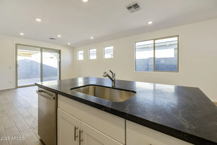 COMES WITH PAINTED CABINETS, QUARTZ COUNTERS, DESIGNER BACKSPLASH, GOURMET KITCHEN PHOTOS ARE OF ANOTHER HOME WITH SIMILAR SELECTIONS.