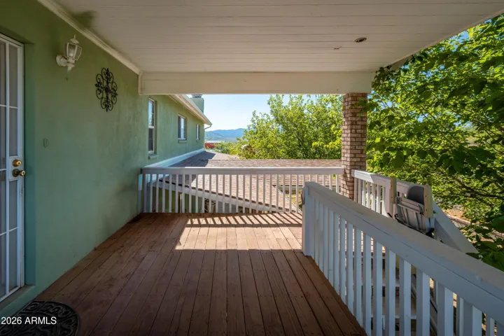 Covered back patio leading to guest kitchen