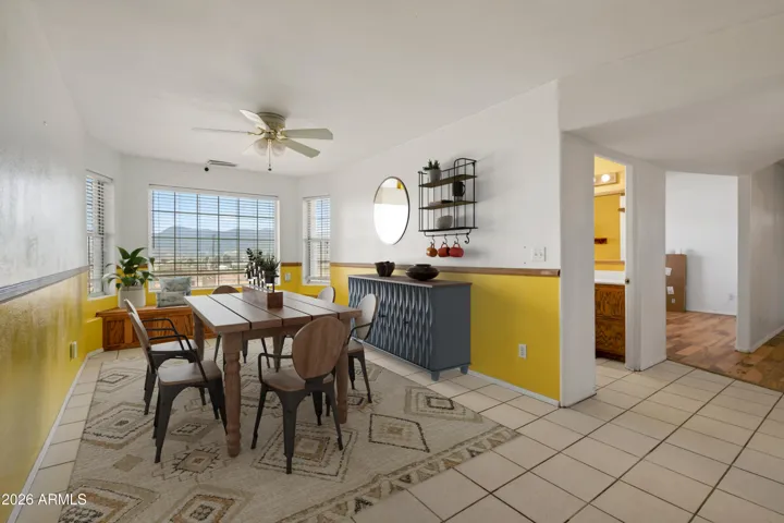 Dining w/ large bay window virtually staged