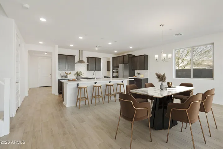 GOURMET KITCHEN WITH BUILT IN APPLINACES. DESIGNER BACKSPLASH, DESIGNER HOOD, GAS COOKTOP AND QUARTZ COUNTERS.