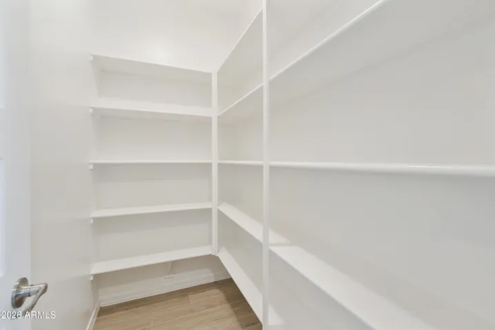 LARGE WALK IN PANTRY WITH LOTS OF STORAGE
