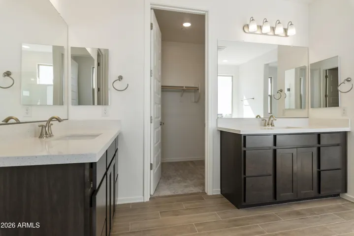SEPARATE TUB AND SHOWER IN THE OWNER'S BATH. HIS AND HER'S CLOSETS AND DUAL VANITIES.