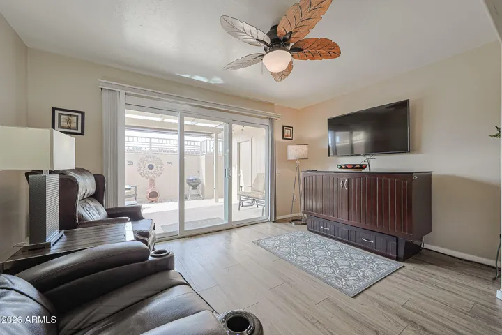 Bonus room between patio and living room. Table under TV is a murphy bed.