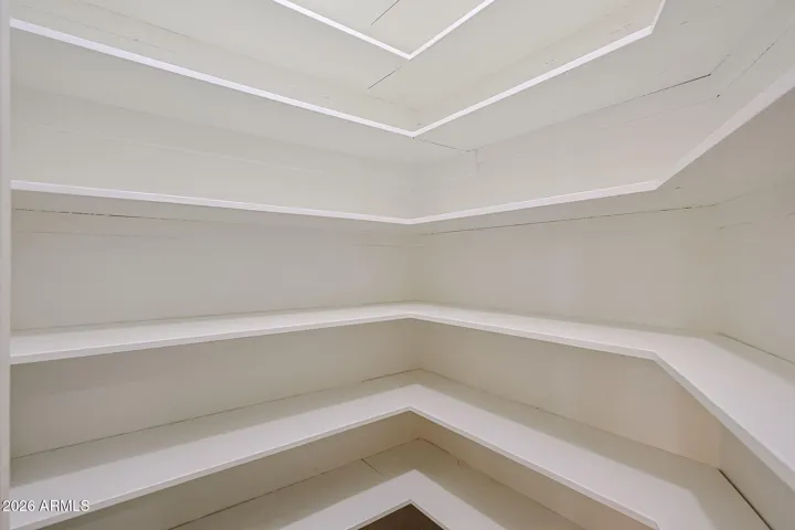 lighted walk in closet near entryway