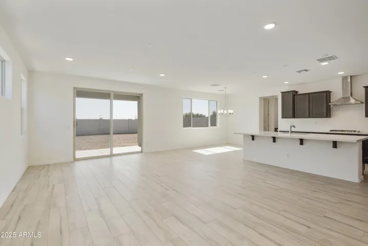 ALL TILE THROUGHOUT THE BOTTOM LEVEL EXCEPT FOR THE GUEST SUITE!