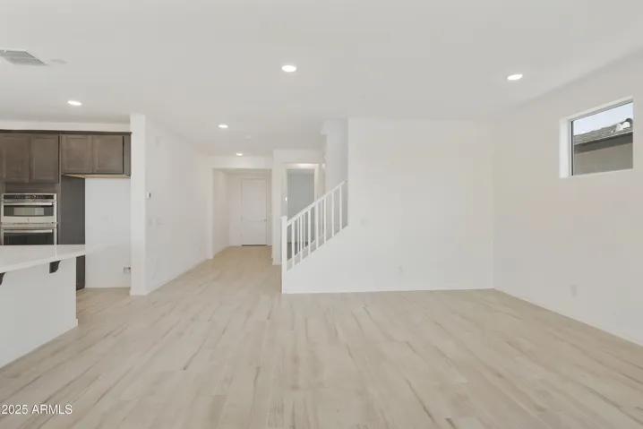 ALL TILE THROUGHOUT THE BOTTOM LEVEL EXCEPT FOR THE GUEST SUITE!