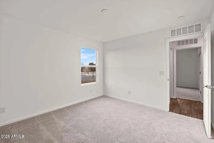 Primary bedroom with bathroom and generous closet.