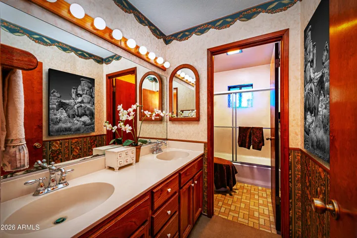 Full bathroom has double sinks, separate shower/toilet room.