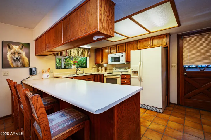 Kitchen counter bar, stove, microwave,refrigerator