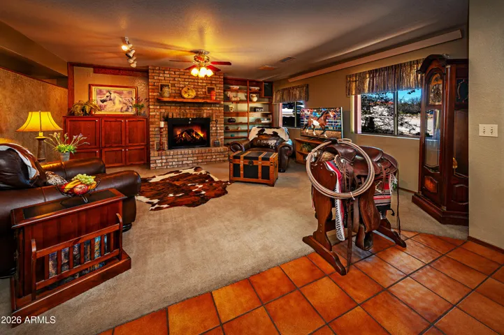 Woodburning fireplace with built-in blowers help to heat home.