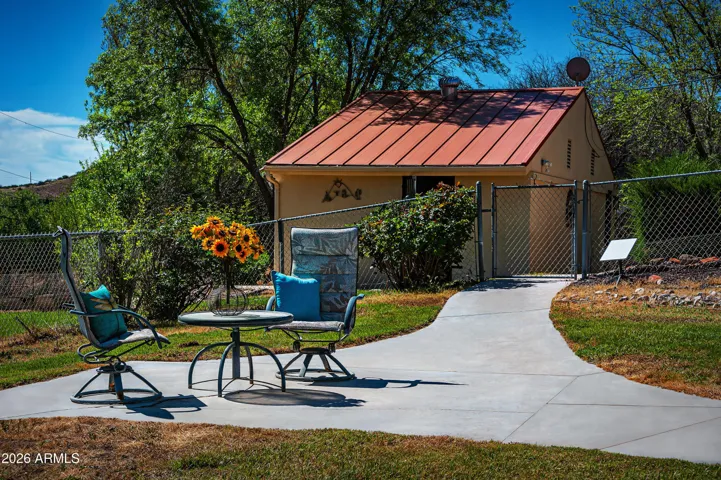 Studio could become guest casita, wide sidewalks and seating many areas make this a charming rest spot.