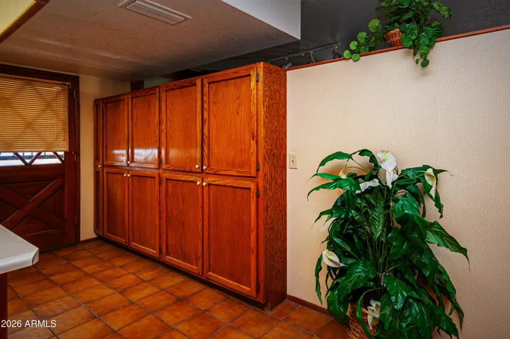 Kitchen with solid Oak cabinetry wall style pantry.