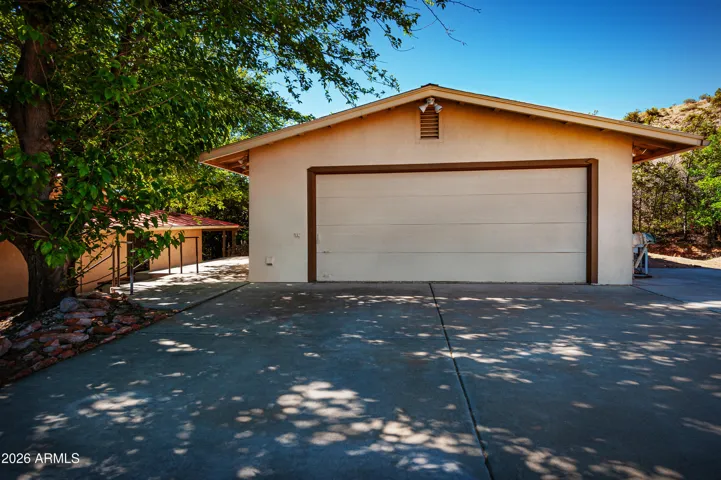 Oversized Garage contains 2 shop rooms, has metal roof.
