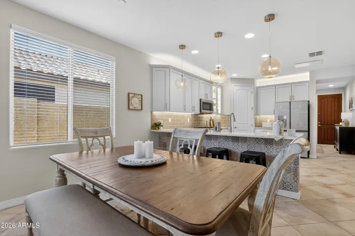 breakfast bar behind the dining room table