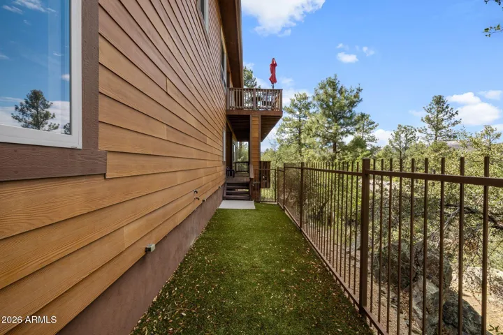 Fenced dog run located at the back of the home.
