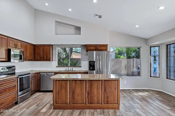 Newer cabinets, granite counter tops, and stainless steel appliances