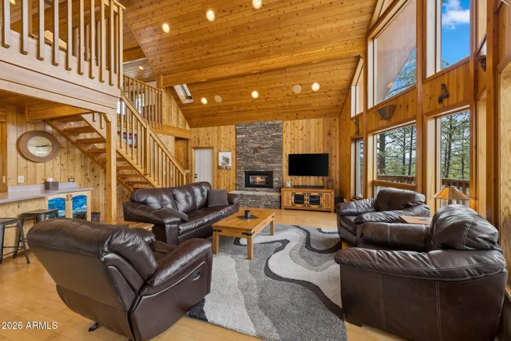 Soaring ceilings with floor to ceiling windows.