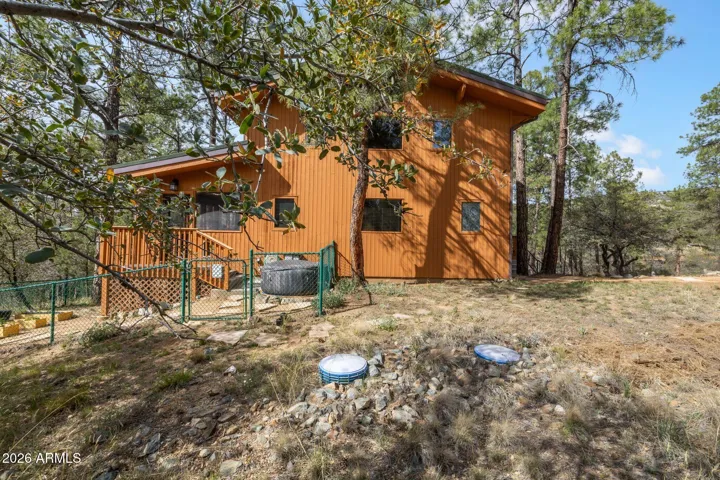 Backyard is partially fenced and ready for your dog.