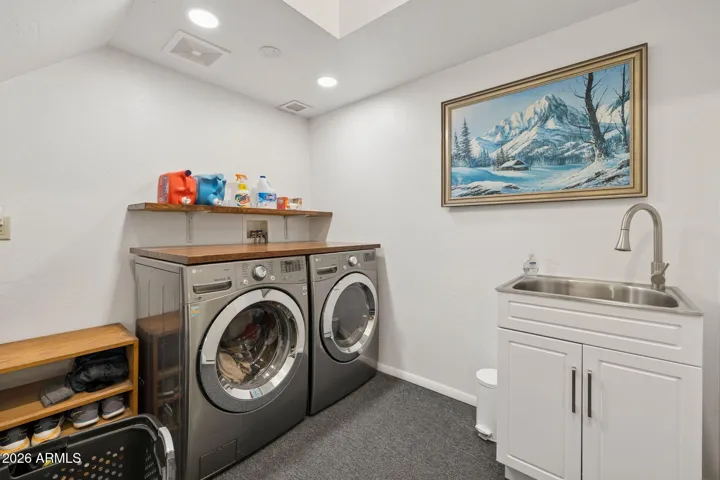 Laundry on the first level with wash sink.