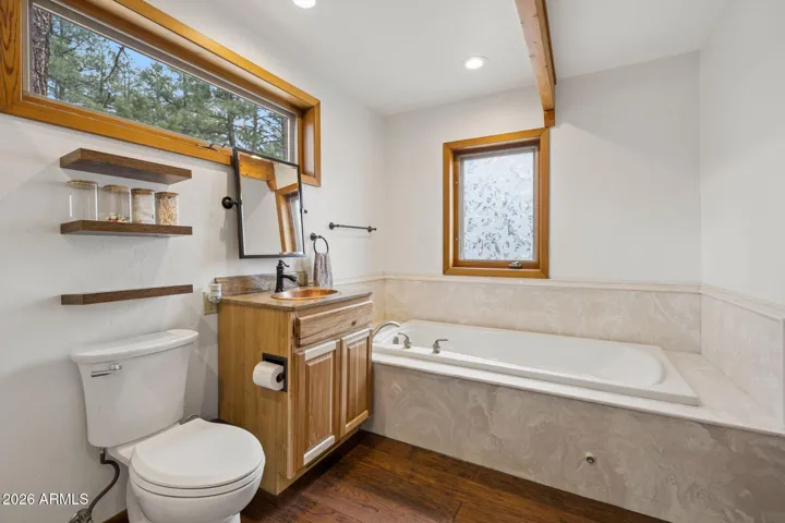 Primary bathroom has separate tub shower set up.