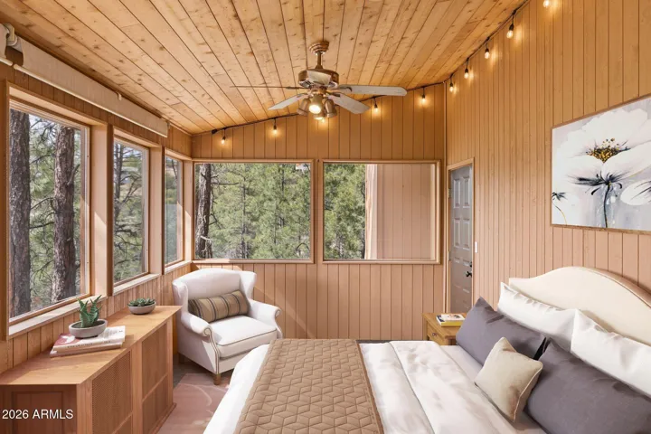 Virtual staging of den conversion to a 3rd bedroom.