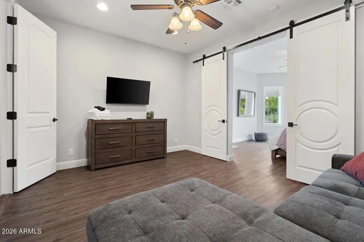 Main floor Primary bedroom with attached siiting area.