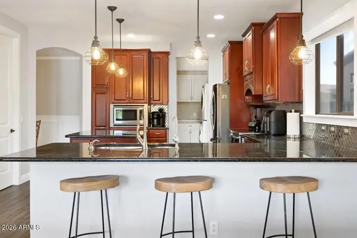 View into kitchen from seating bar. Everyone has a seat !