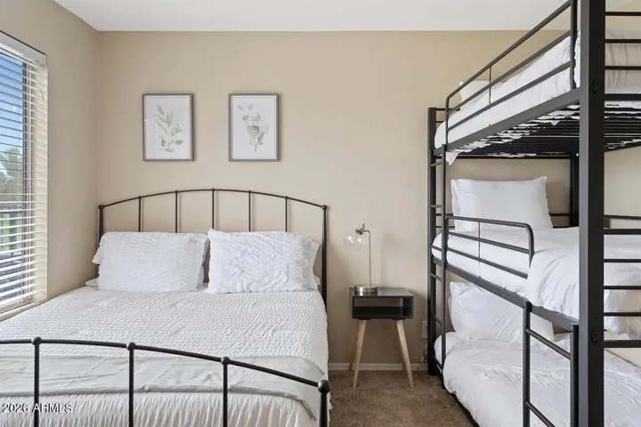 Triple bunkbed +1 in upstairs bedroom.