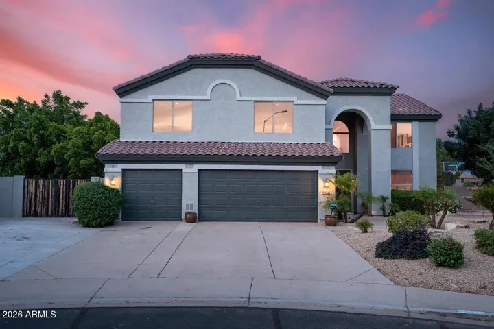 Large 3 car garage with built in storage cabinets.