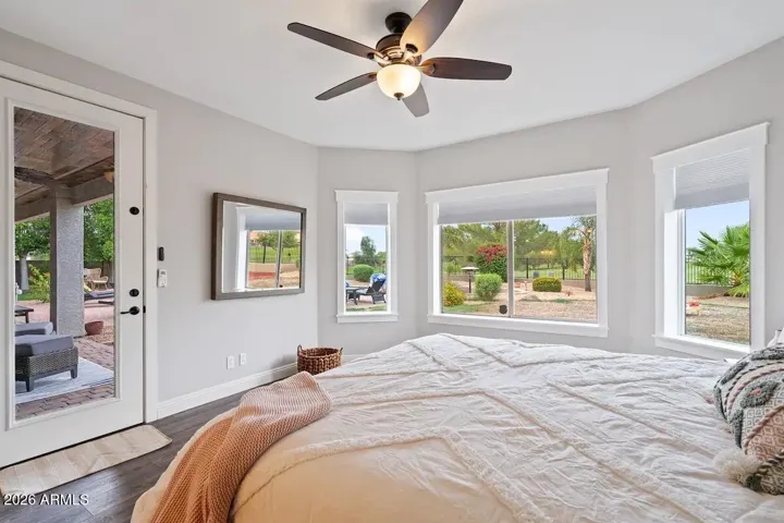 Another view of primary with separate door to outside patio, jacuzzi and pool.
