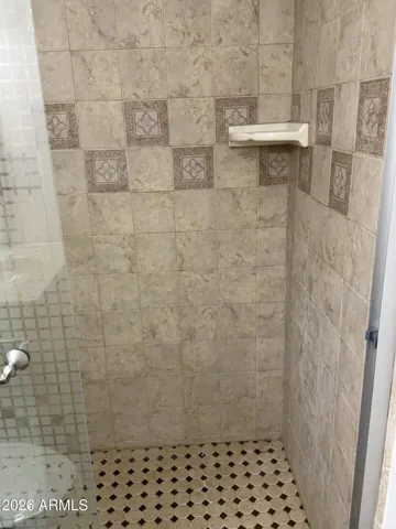 Master bath full tile surround walk in shower with glass doors