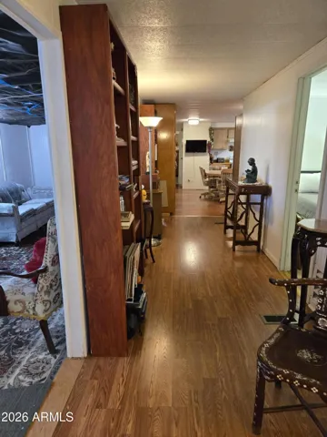 Hallway from bedroom 2, living room on left bathroom 1 on right