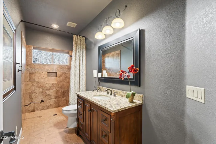 Bath 2 with a roll-in shower.