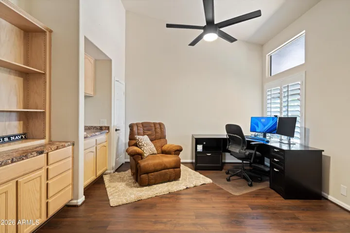 Large office with a wet bar.