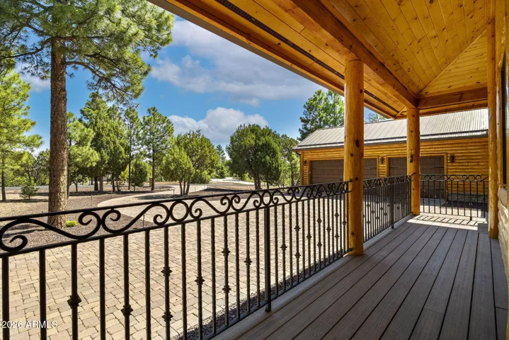 Wrap around decking with custom iron works