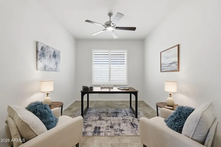 The den is currently set up as an office area but easily could be made into a TV room or another sitting area